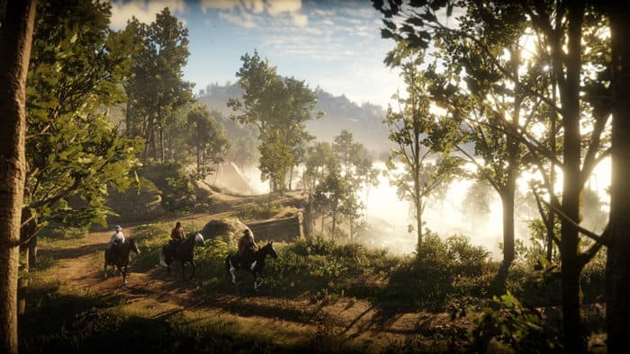 La bande d'Arthur Morgan chevauchant dans les bois dans Red Dead Redemption 2