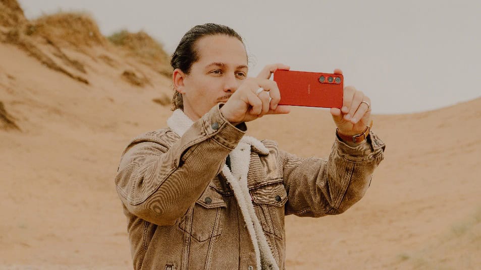 A person taking a selfie Description automatically generated